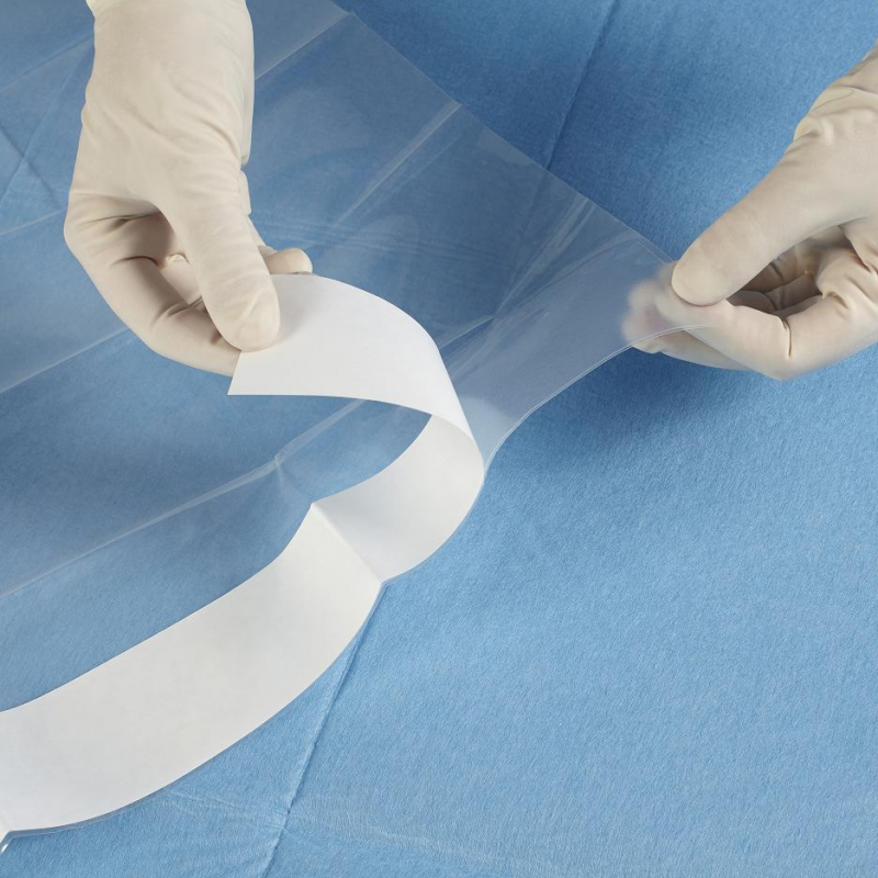 Sterile transparent drape with adhesive